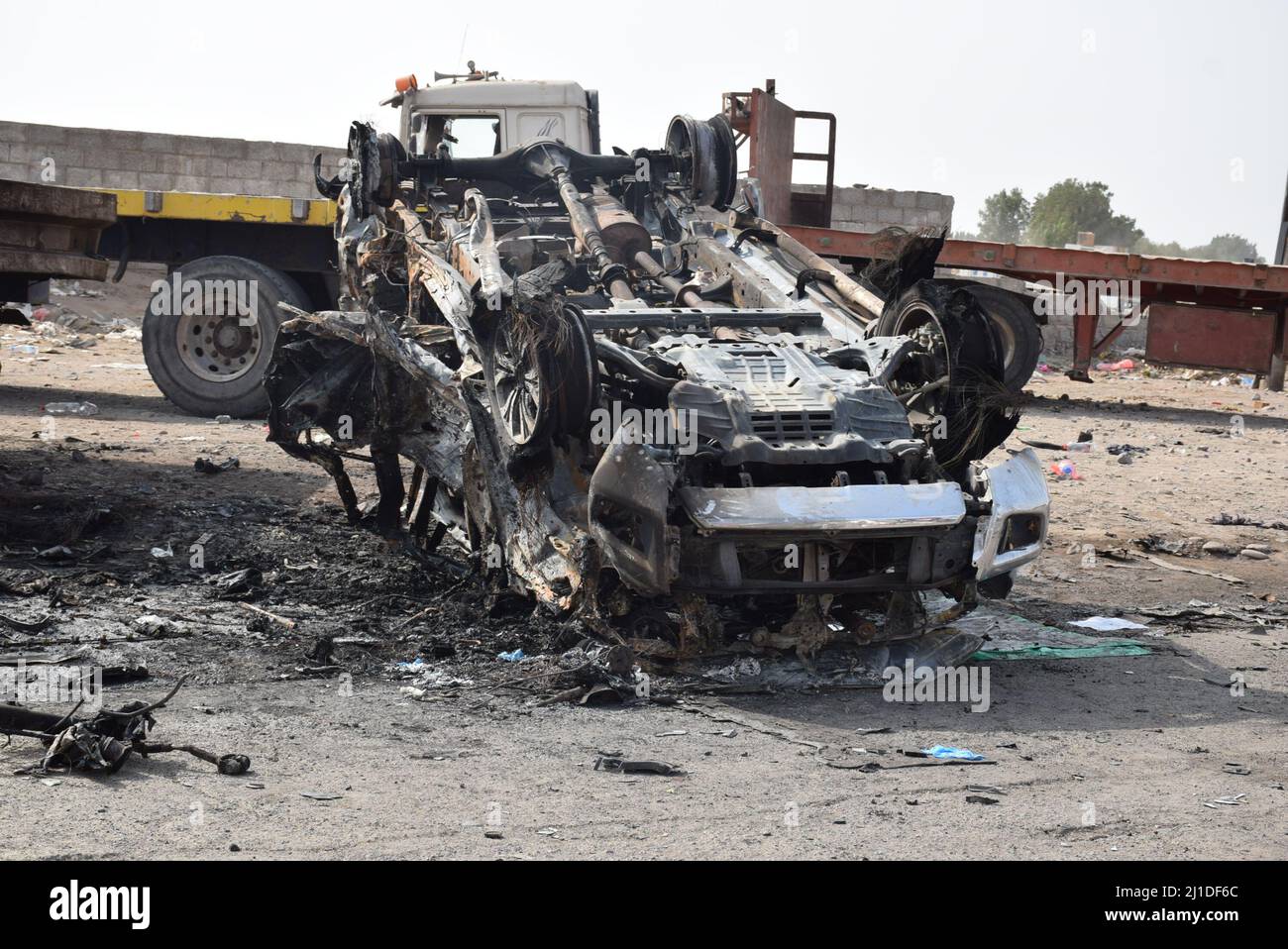 Aden, Yemen. 24th Mar, 2022. The wreckage of a car is seen on a street of Aden, the southern port city of Yemen, on March 24, 2022. A deadly booby trap bomb attack in southern Yemen's Aden killed a high-ranking military commander of the Yemeni army and three bodyguards on Wednesday, a government official told Xinhua. Credit: Murad Abdo/Xinhua/Alamy Live News Stock Photo