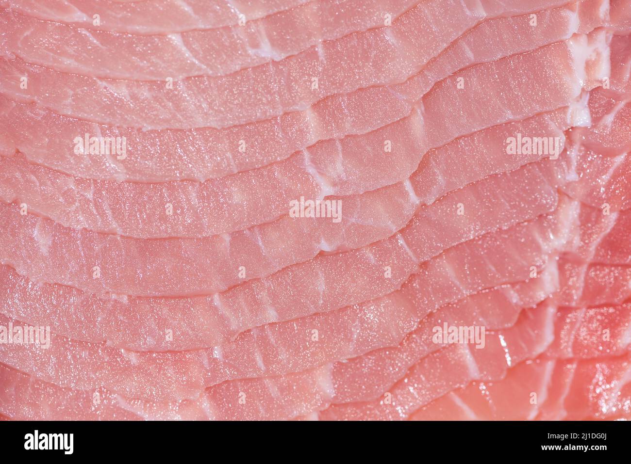 Closeup top view pieces raw meat of fresh pork slices are sliced into