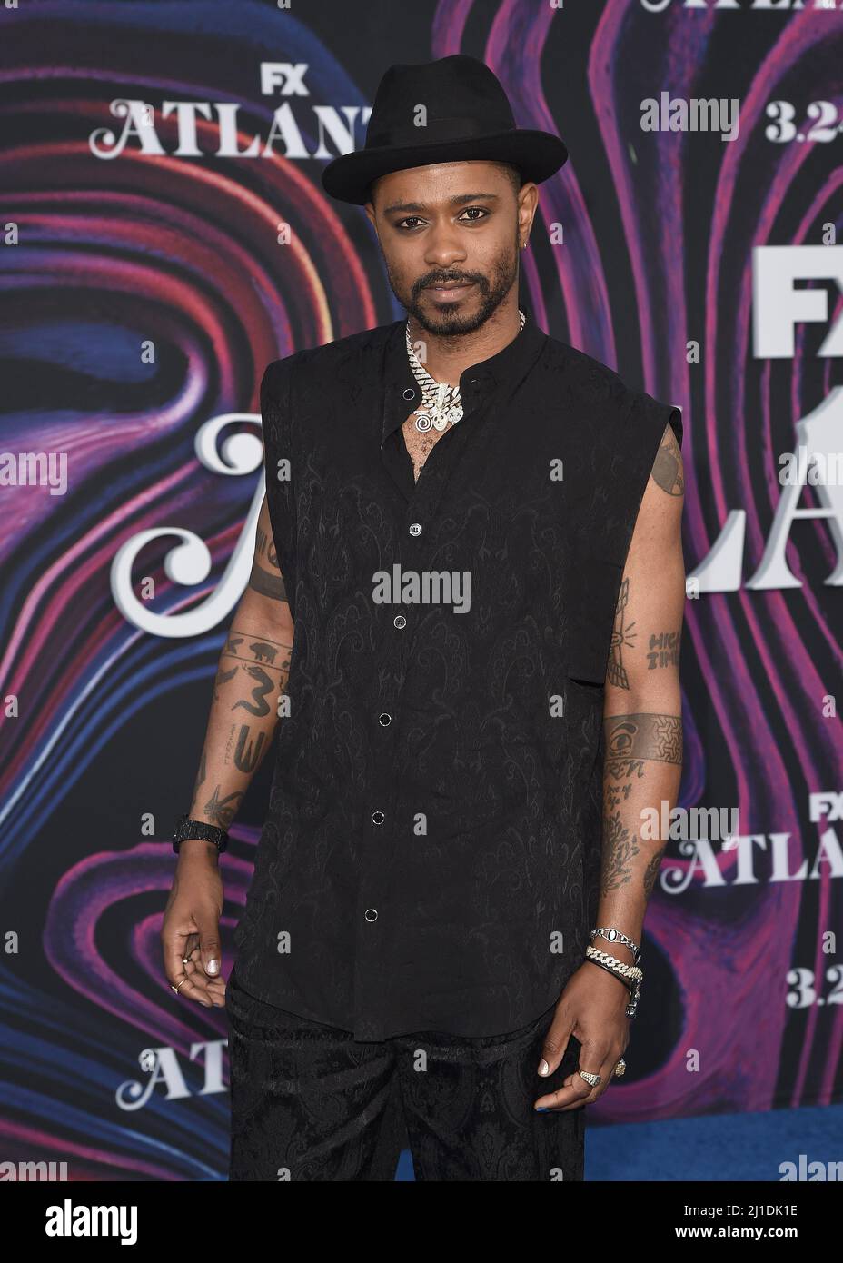 LaKeith Stanfield walking on the red carpet at the red carpet event for the 3rd season of FX's