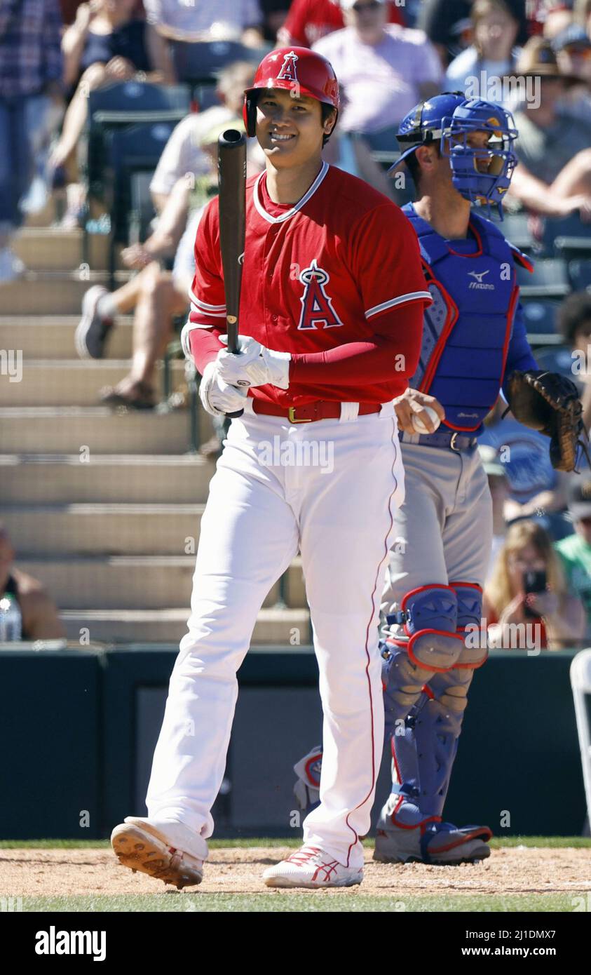 Shohei Ohtani of the Los Angeles Angels reacts after drawing a walk in the  fifth inning of a spring training baseball game against the Chicago Cubs on  March 24, 2022, in Tempe,