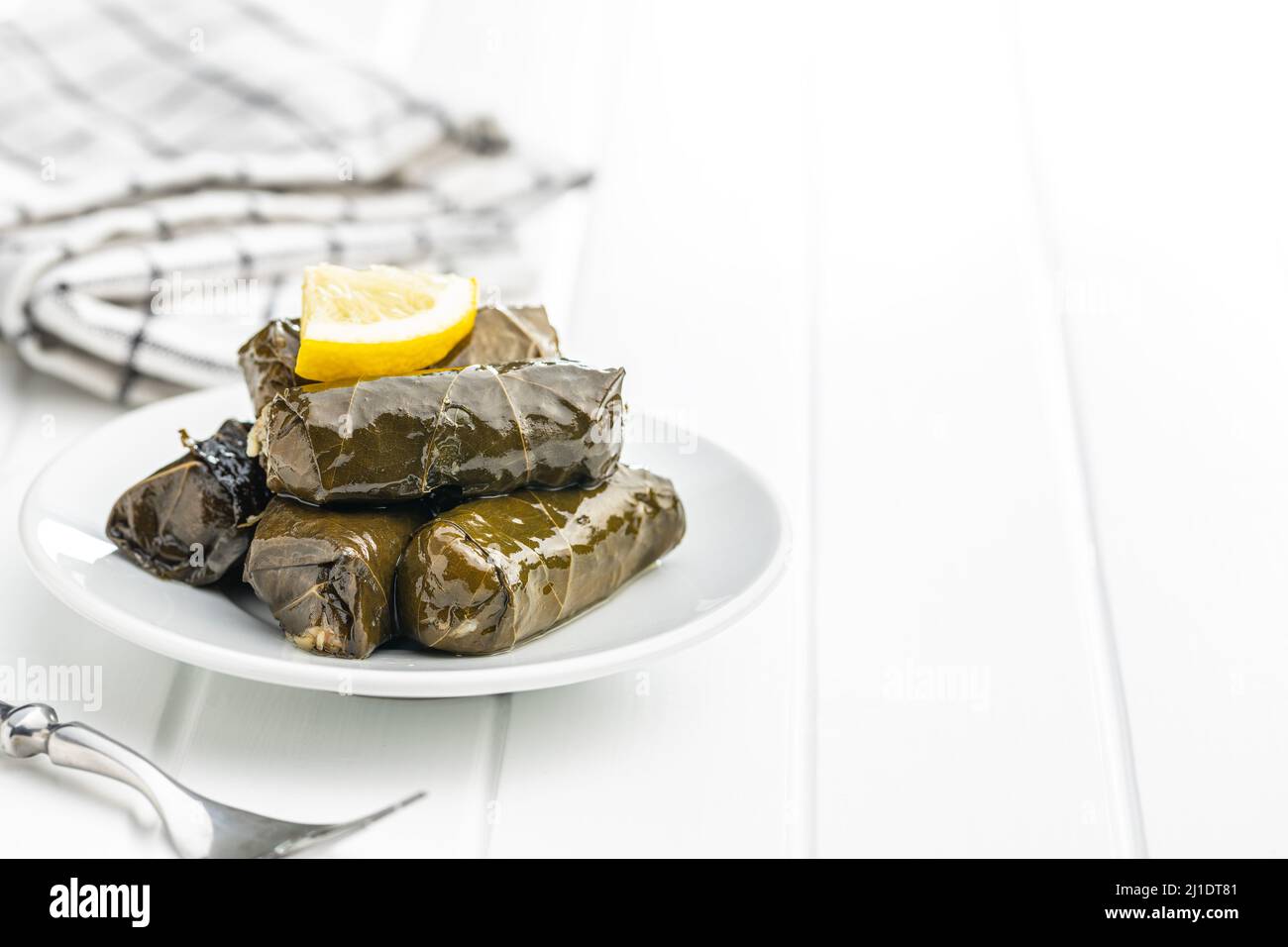 Dolmades. Stuffed vine leaves. Greek appetizer on the plate Stock Photo