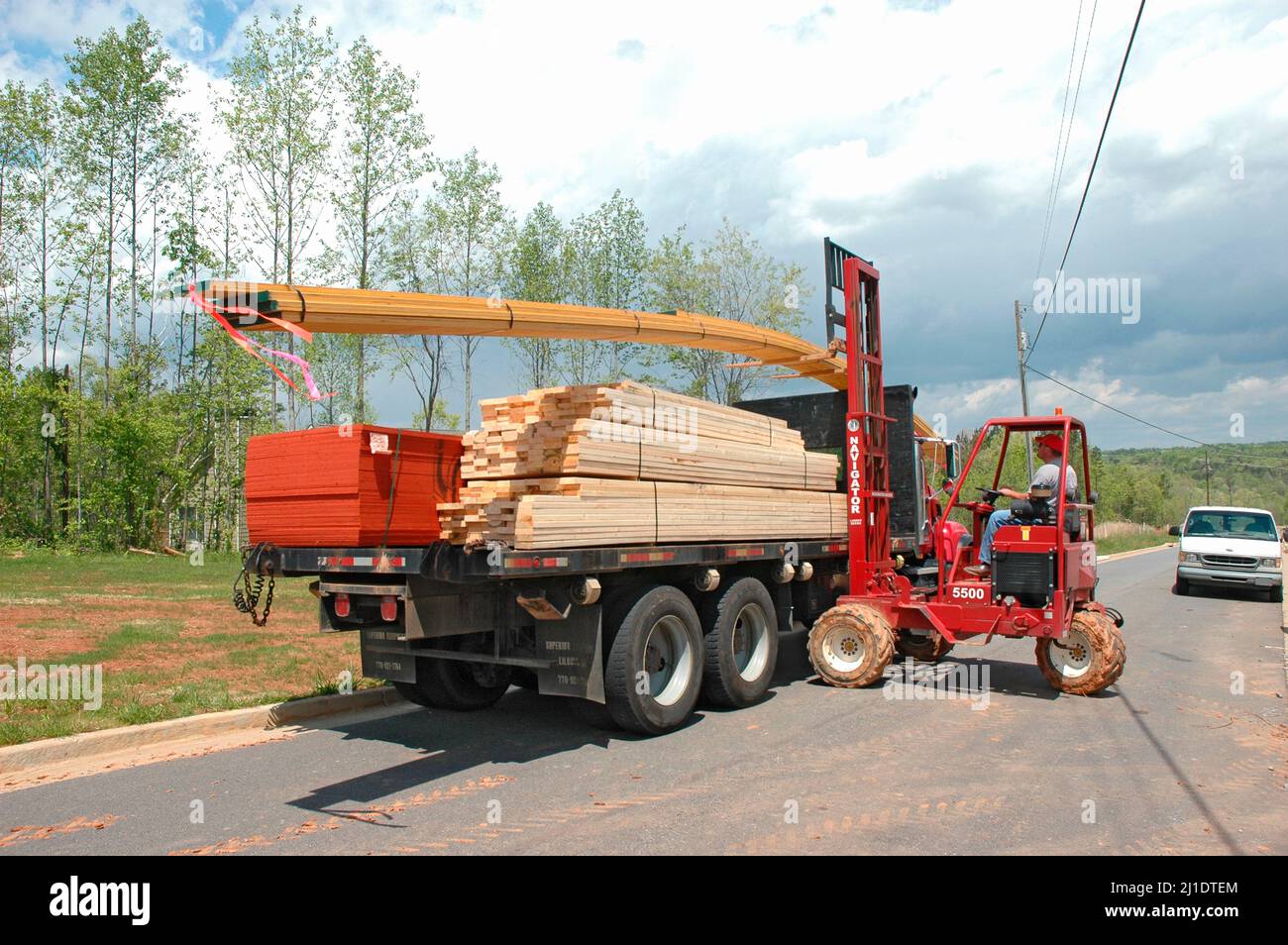 Delivering lumber by truck and fork lift the materials for wood 