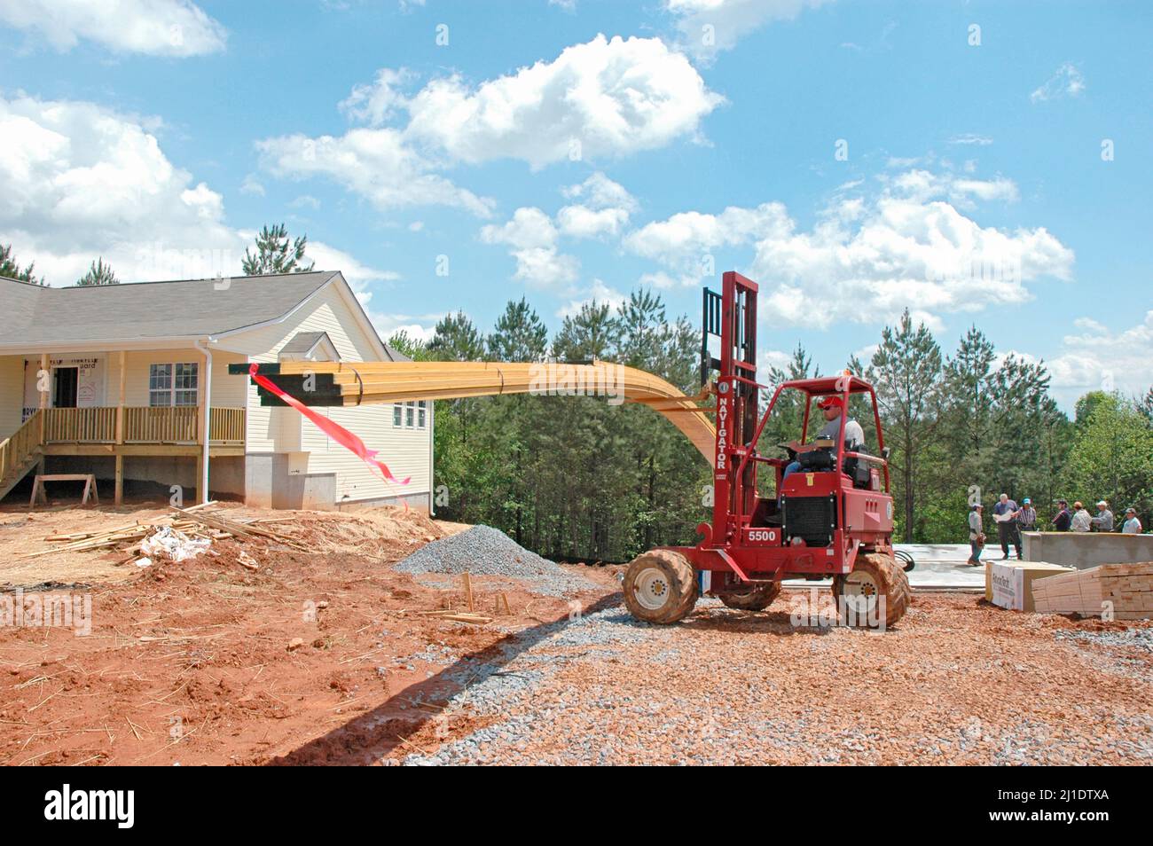 Delivering lumber by truck and fork lift the materials for wood 