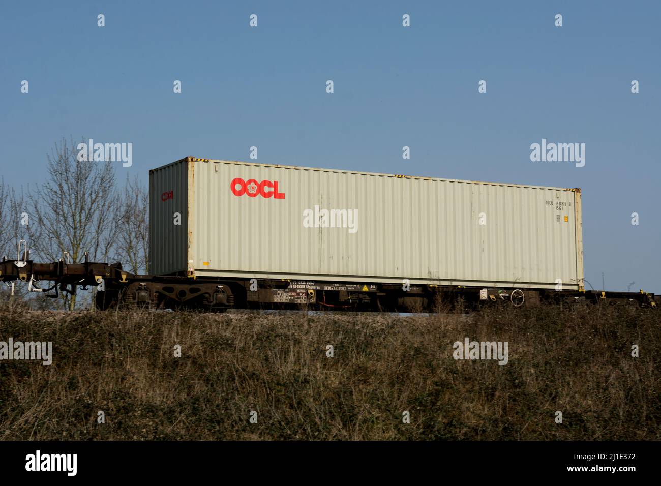 OOCL shipping container on a freightliner train, Warwickshire, UK Stock Photo