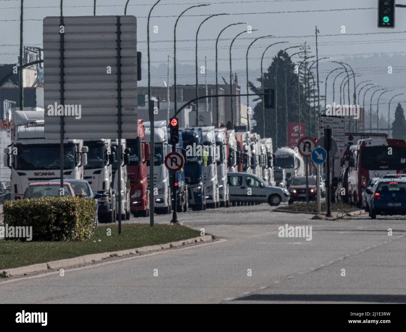 Burgos, Spain. 24th Mar, 2022. A queue of trucks stops on Madrid-Irun highway during the protest. Truckers join the transport strike as they pass through the city of Burgos. The strike is due to the rise in fuel prices and their working conditions, they have been paralyzing the country for a week. Credit: SOPA Images Limited/Alamy Live News Stock Photo