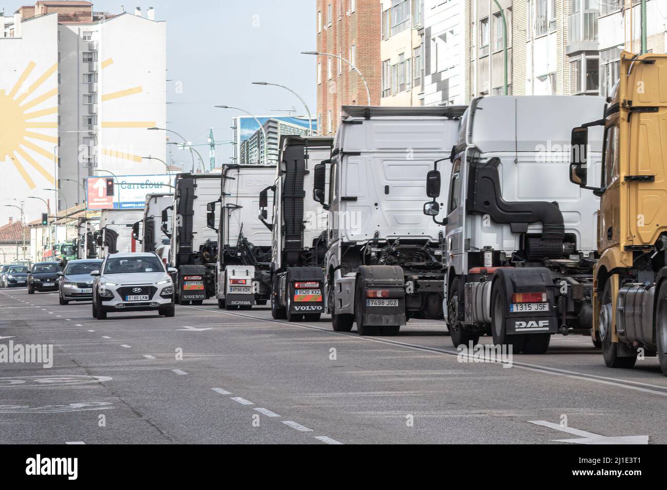 Burgos, Spain. 24th Mar, 2022. A line of trucks seen on Vitoria Street during the protest. Truckers join the transport strike as they pass through the city of Burgos. The strike is due to the rise in fuel prices and their working conditions, they have been paralyzing the country for a week. Credit: SOPA Images Limited/Alamy Live News Stock Photo