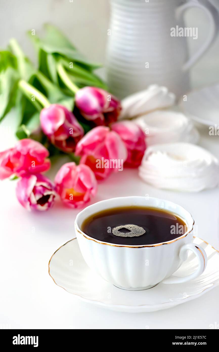 Romantic morning cup of tea. Bouquet pink tulip. Selective focus ...