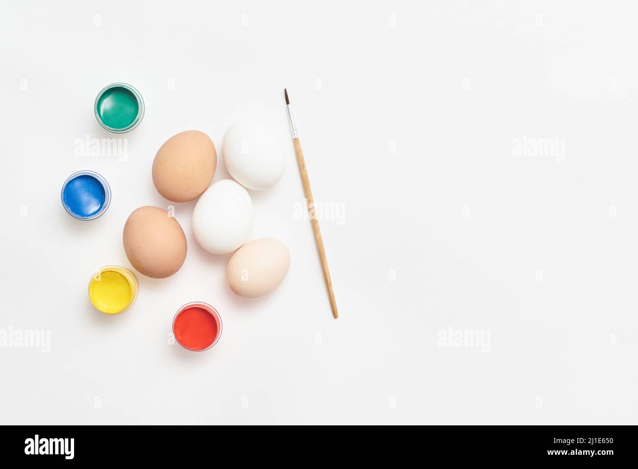 Eggs and paints for Easter on a white background Stock Photo