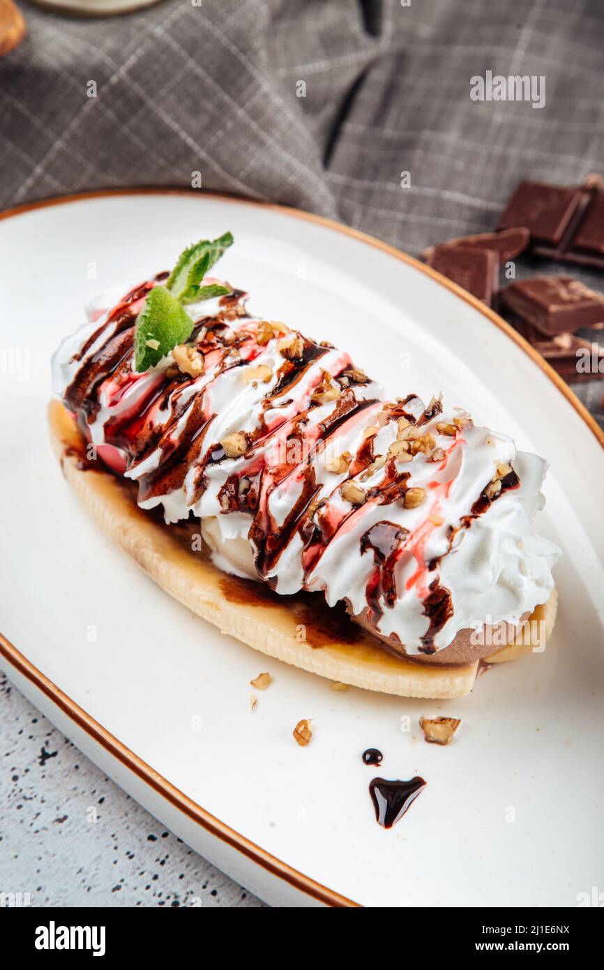Banana split dessert with nuts Stock Photo Alamy