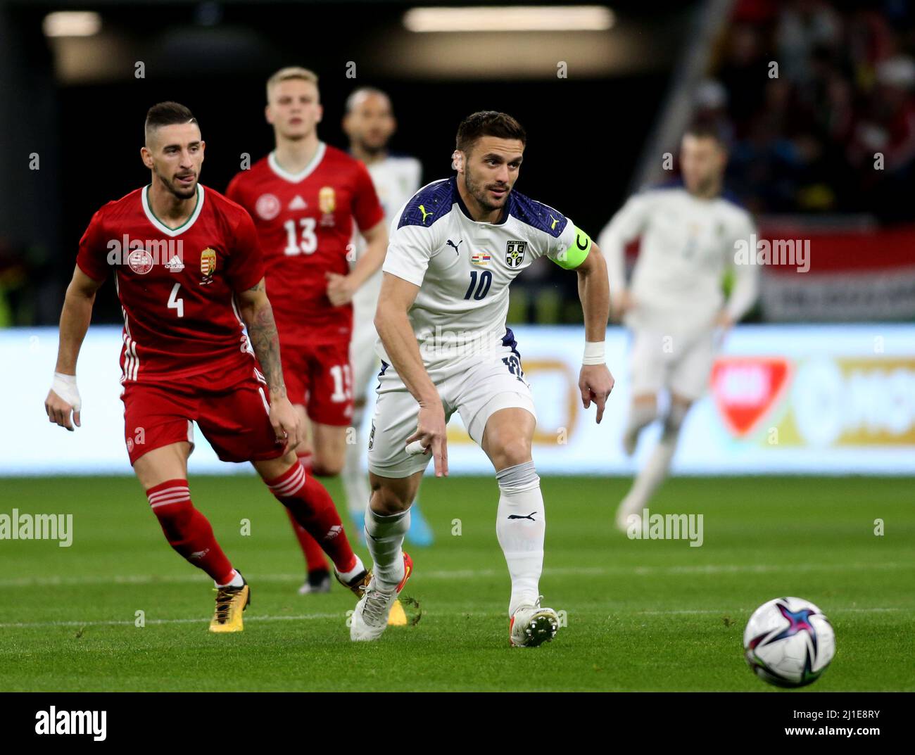 BUDAPEST, HUNGARY - MARCH 24: Dusan Tadic of Serbia competes for the ball with Zsolt Nagy of Hungary ,during the international friendly match between Hungary and Serbia at Puskas Arena on March 24, 2022 in Budapest, Hungary. (Photo by MB Media) Stock Photo