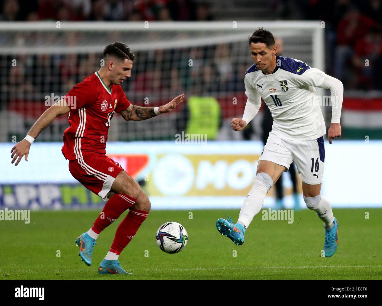 BUDAPEST, HUNGARY - MARCH 24: Sasa Lukic of Serbia competes for the ball with Roland Sallai of Hungary ,during the international friendly match between Hungary and Serbia at Puskas Arena on March 24, 2022 in Budapest, Hungary. (Photo by MB Media) Stock Photo