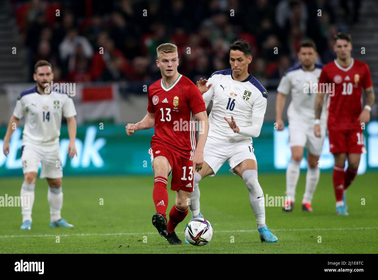 BUDAPEST, HUNGARY - MARCH 24: Andras Schafer of Hungary competes for the ball with Sasa Lukic of Serbia ,during the international friendly match between Hungary and Serbia at Puskas Arena on March 24, 2022 in Budapest, Hungary. (Photo by MB Media) Stock Photo
