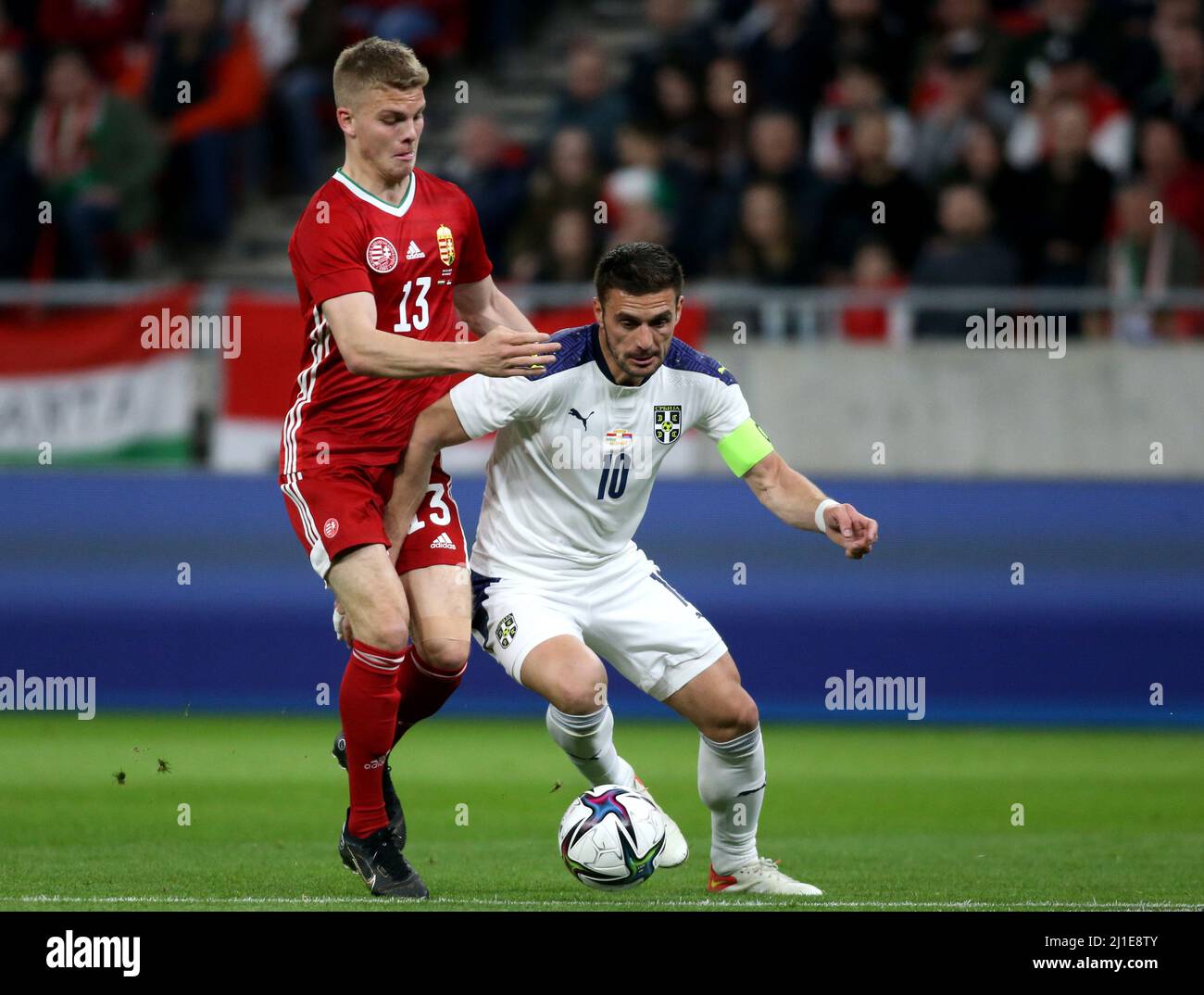BUDAPEST, HUNGARY - MARCH 24: Dusan Tadic of Serbia competes for the ball with Andras Schafer of Hungary ,during the international friendly match between Hungary and Serbia at Puskas Arena on March 24, 2022 in Budapest, Hungary. (Photo by MB Media) Stock Photo