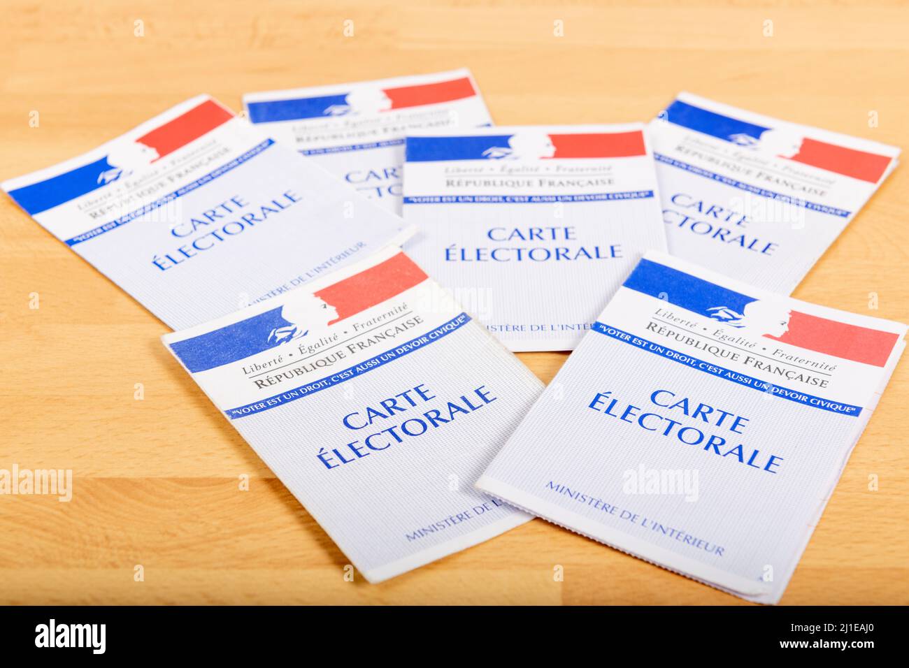 France, Paris, March 22, 2022, French electoral voter cards official government allowing to vote paper on wooden background, France Stock Photo