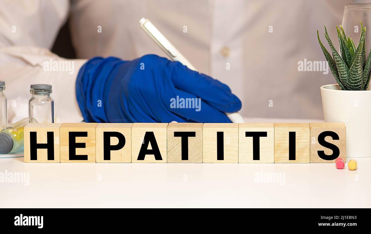 Hepatitis word written on wood block, concept Stock Photo - Alamy