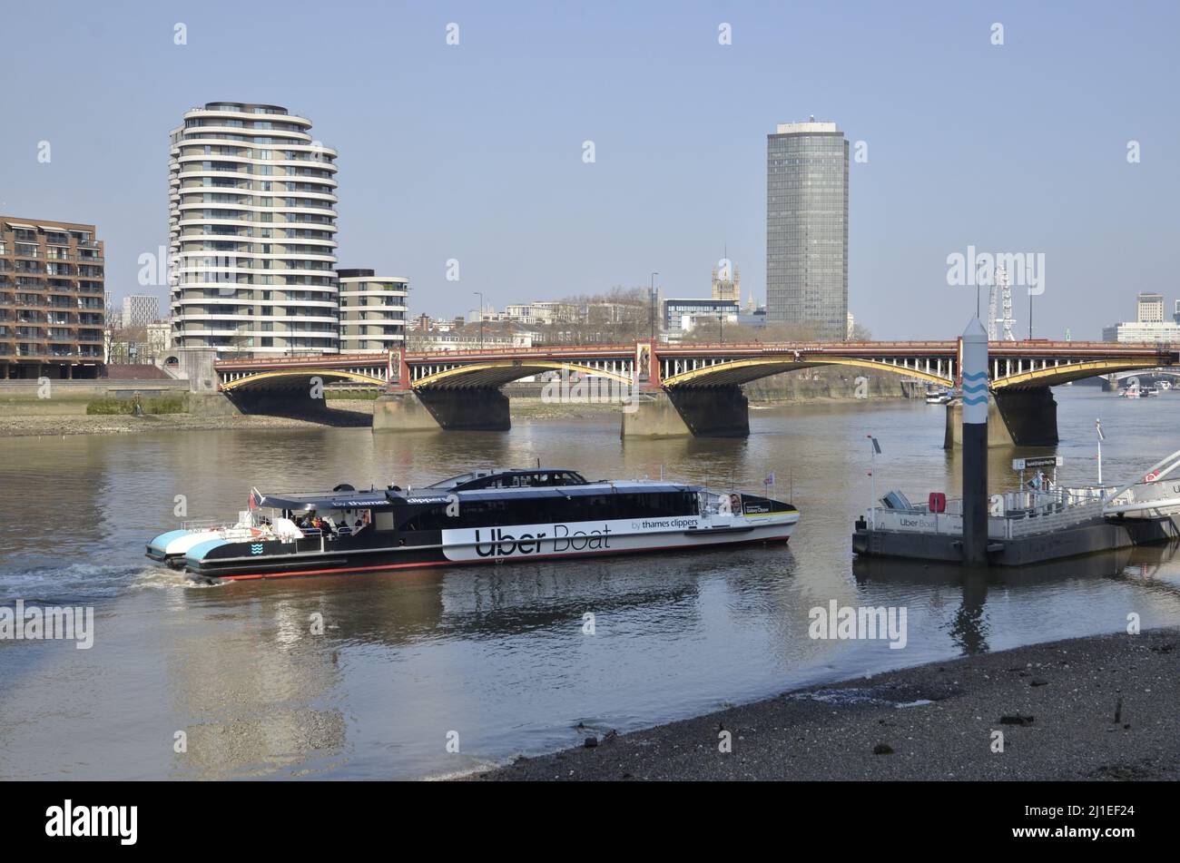 An Uber Boat run by Thames Clippers arriving at St George's Wharf in Vauxhall, London Stock Photo