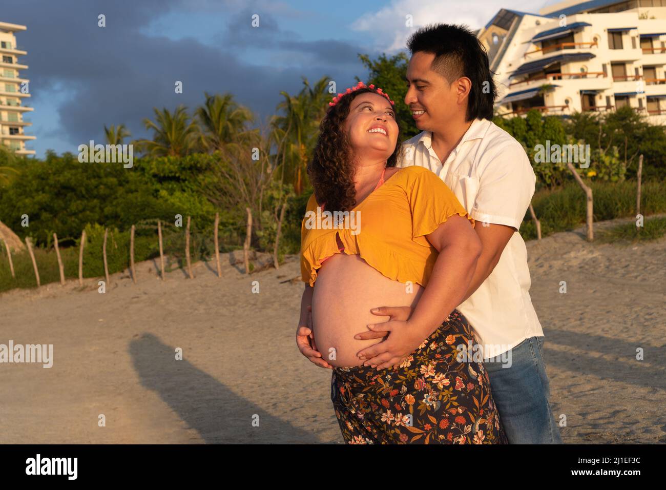 Future parents couple at sunset Stock Photo - Alamy