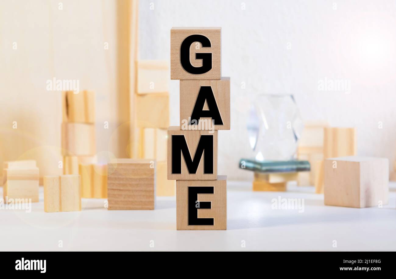 Game word written with different colored letter blocks arranged on a ...