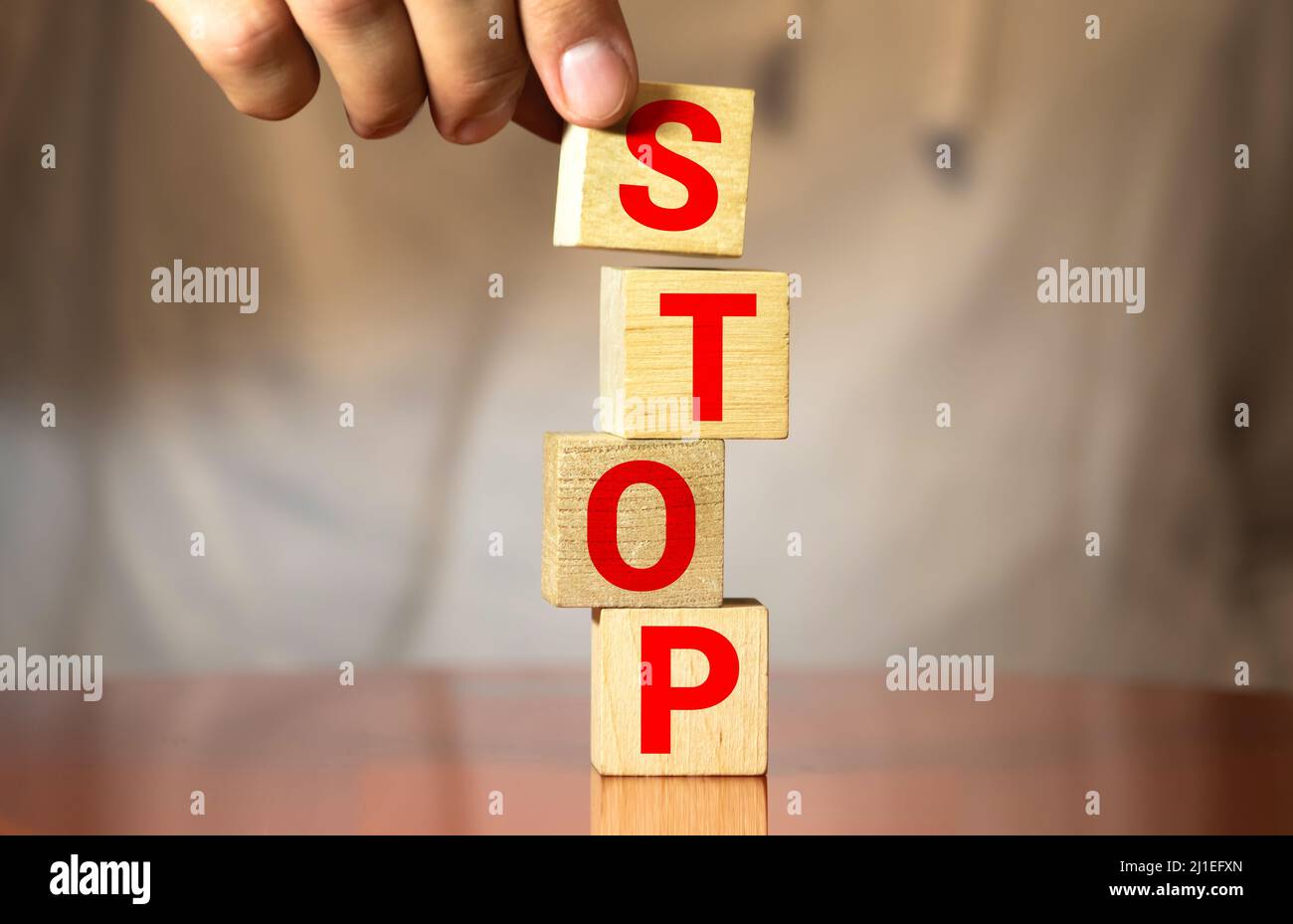 Stop Word Not Sign STOP word concept written on wooden cubes blocks lying on a light table ...