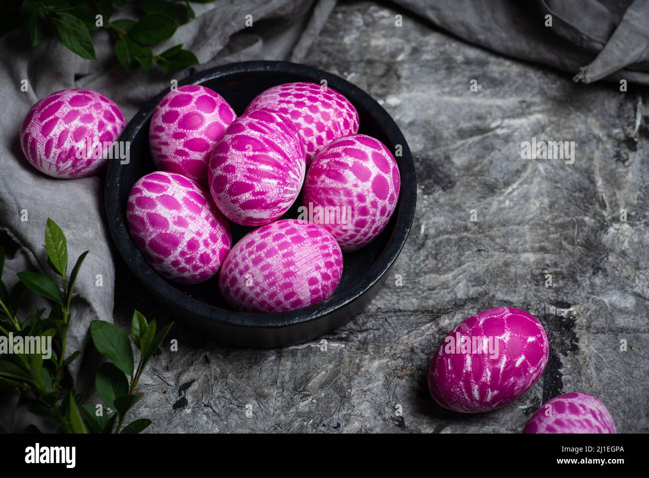 Lace pattern painted Easter eggs in a bowl with copy space top view. Easter holiday background Stock Photo