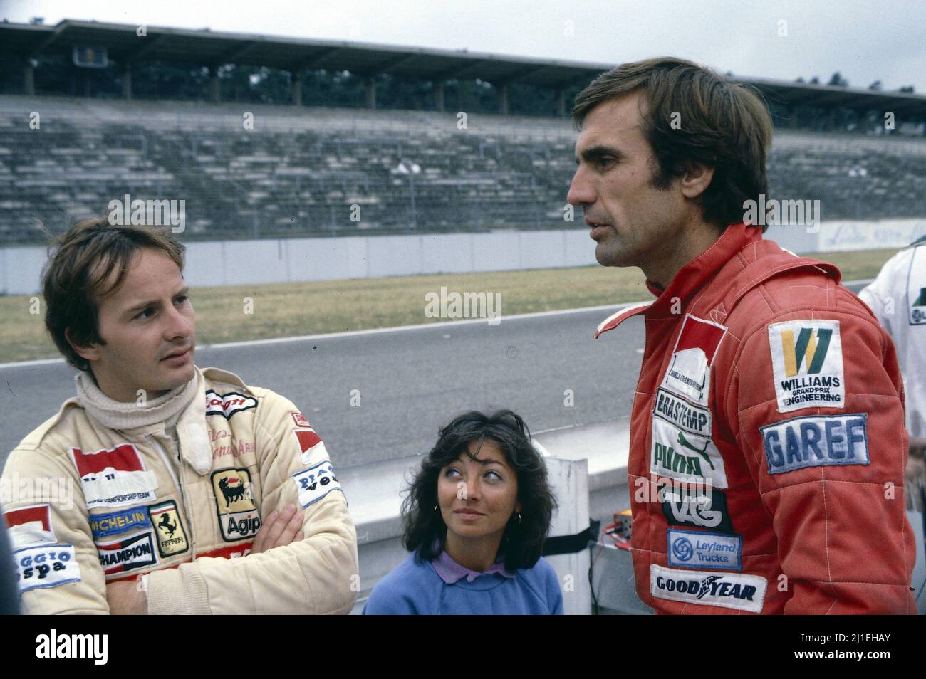 Gilles Villeneuve (CDN) Ferrari with wife Joan talks with Carlos Reutemann (ARG) Williams Stock Photo