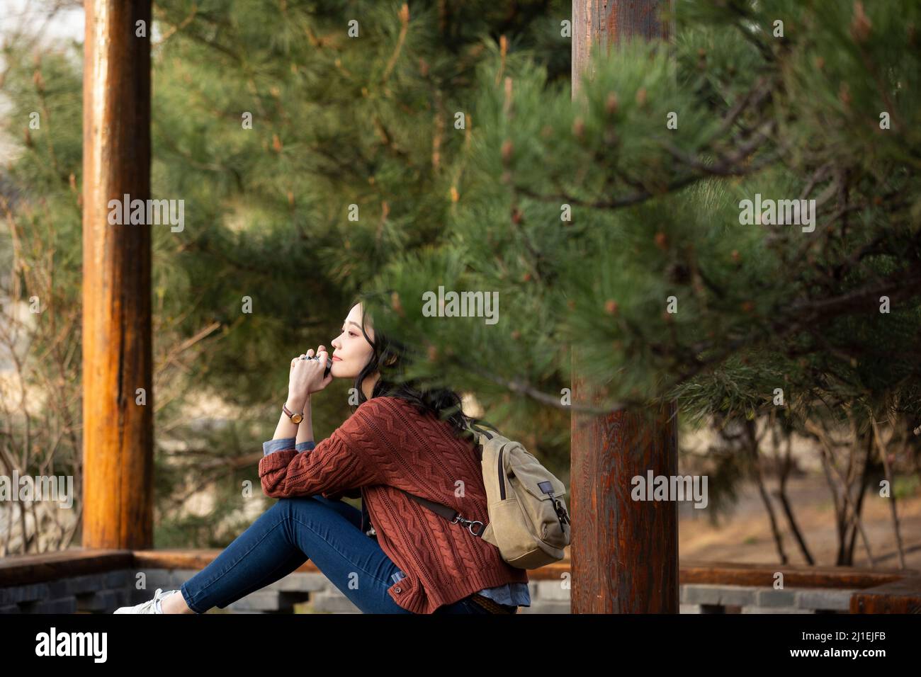 Female tourist resting in a park - stock photo Stock Photo