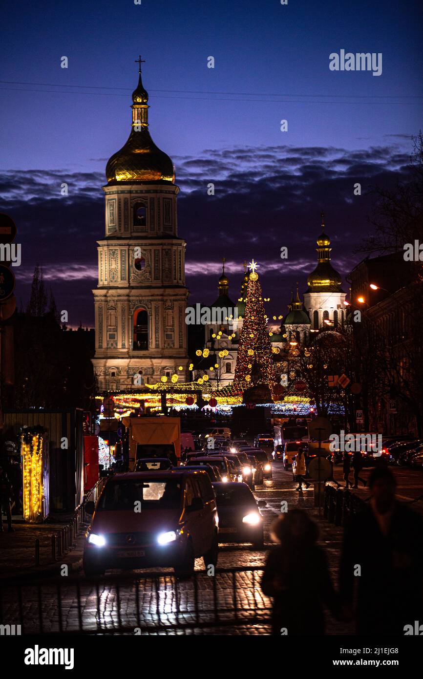 The 2022 January lights and view of Christmas tree on Sofia square in Kyiv near the XI-XVIII century St Sofia Bell Tower, Bogdan Khmelnitsky monument Stock Photo