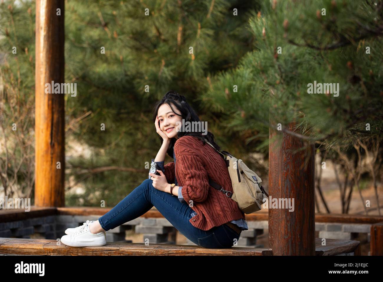 Female tourist resting in a park - stock photo Stock Photo