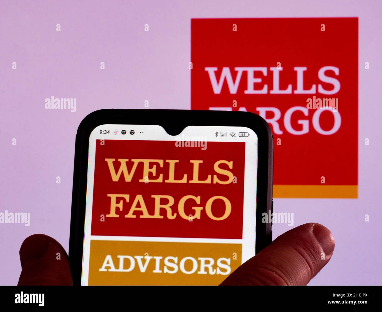In this photo illustration, the Wells Fargo Advisors logo is displayed on a smartphone screen