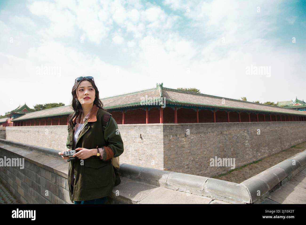 Young female tourist sightseeing on the walls of the ancient city - stock photo Stock Photo