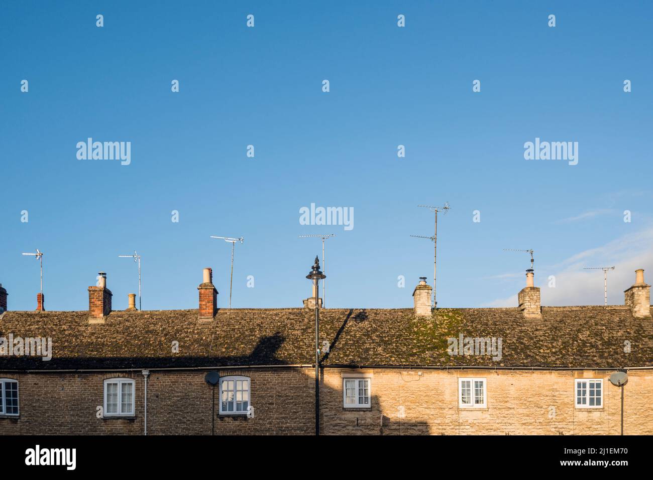 Cotswold stone cottages with TV aerial on roof, Cotswold town Tetbury, Gloucestershire, UK Stock Photo