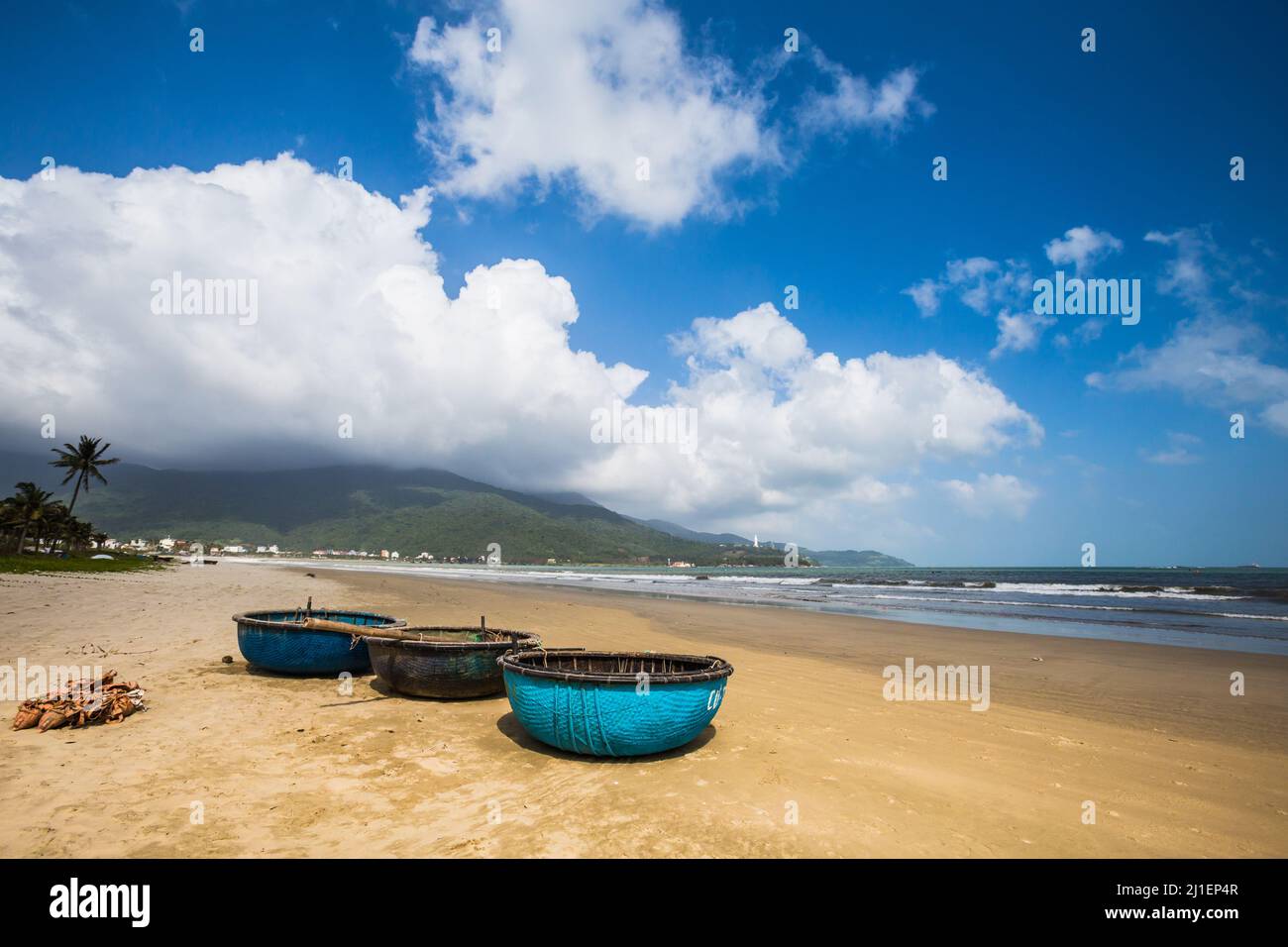 Beautiful pristine Bai Tam Pham Van Dong - My Khe beach in Danang, Vietnam. Sunny day landscape. Son Tra - Lady Buddha Pagoda in the background Stock Photo