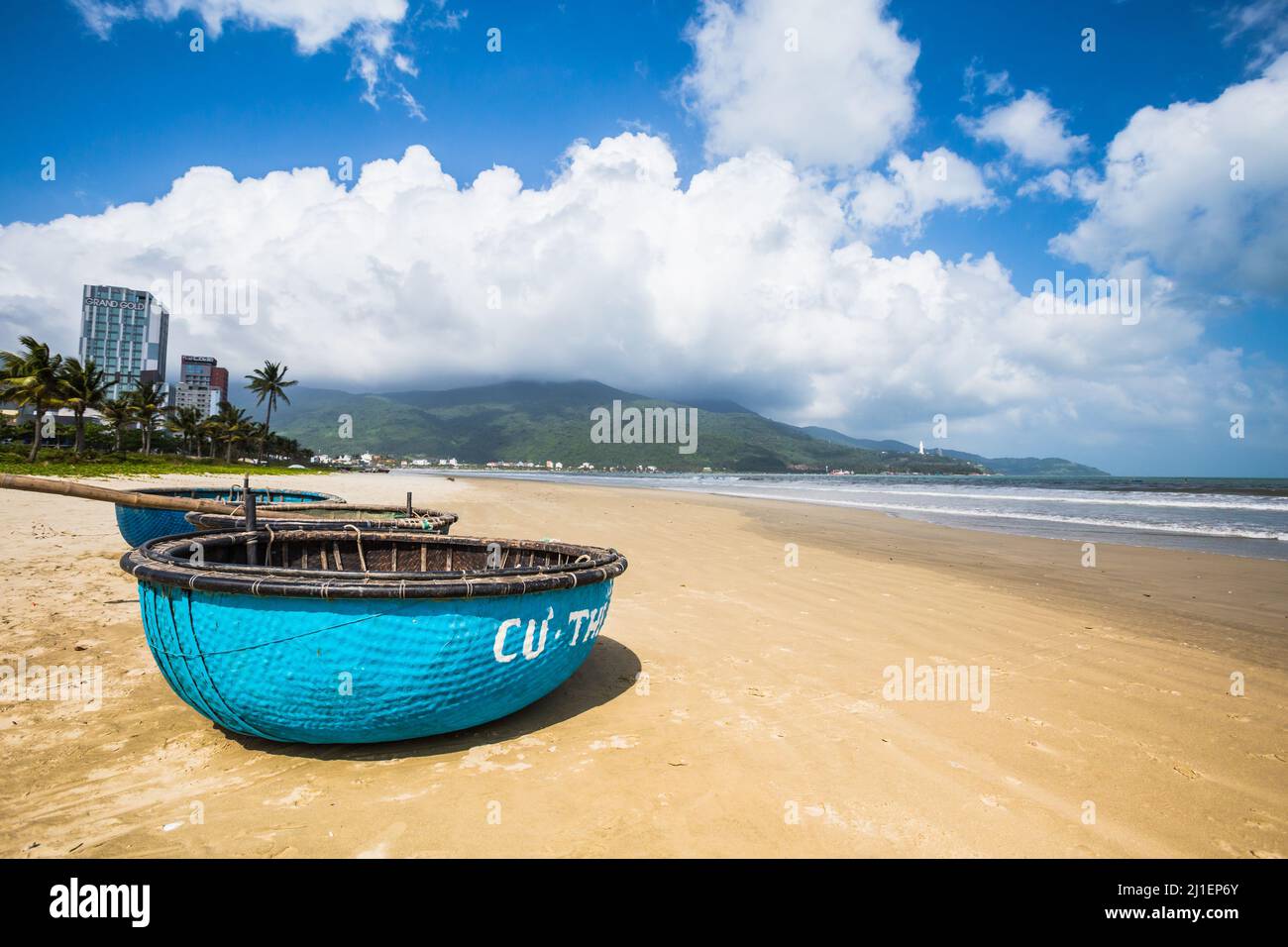 Beautiful pristine Bai Tam Pham Van Dong - My Khe beach in Danang, Vietnam. Sunny day landscape. Son Tra - Lady Buddha Pagoda in the background Stock Photo