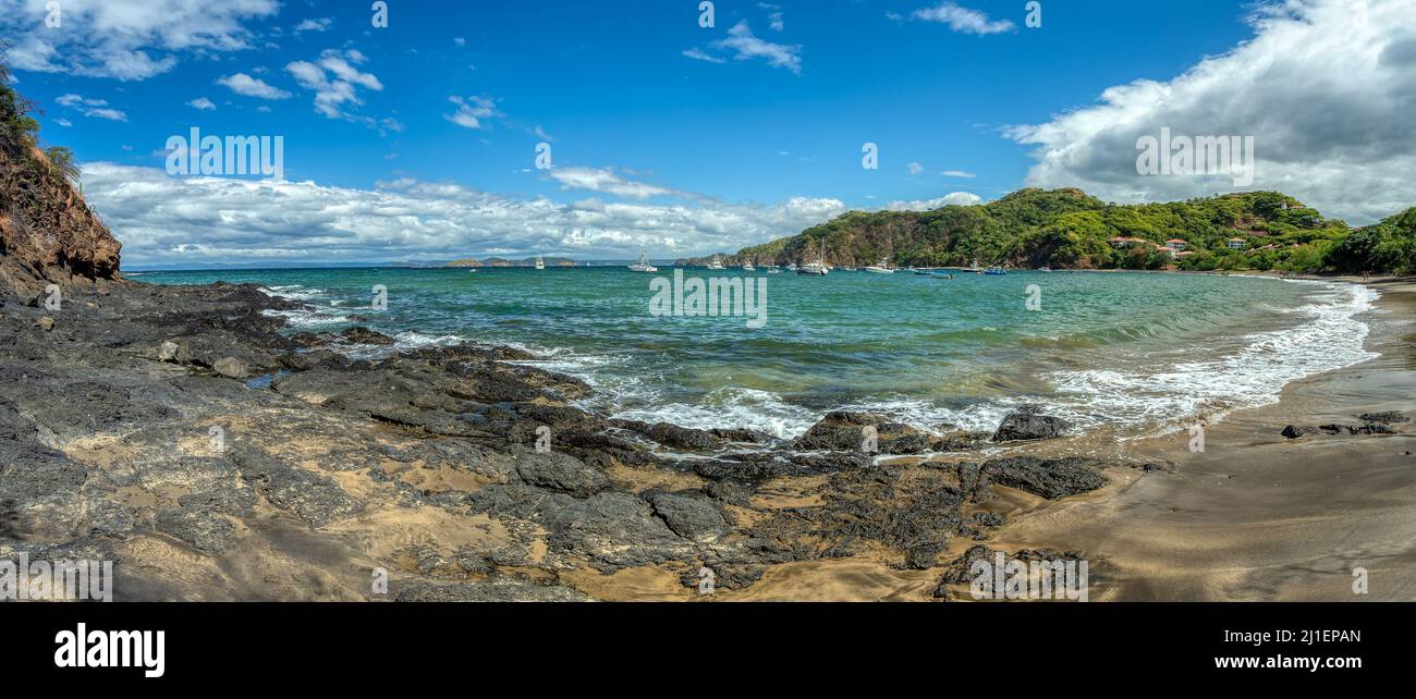 Playa Ocotal with Pacific ocean waves on rocky shore, El Coco Costa