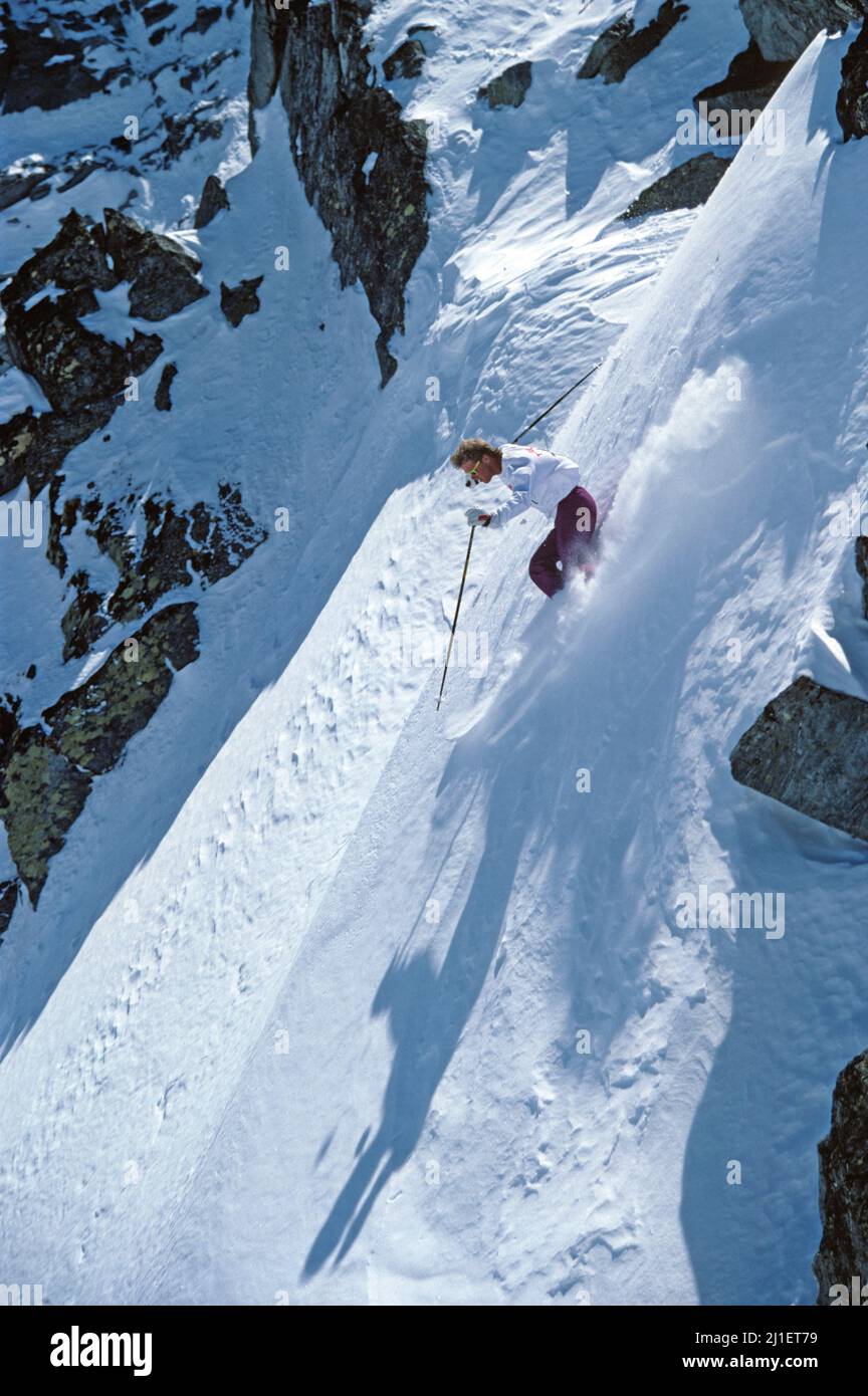 New Zealand. Young man downhill skiing. Stock Photo