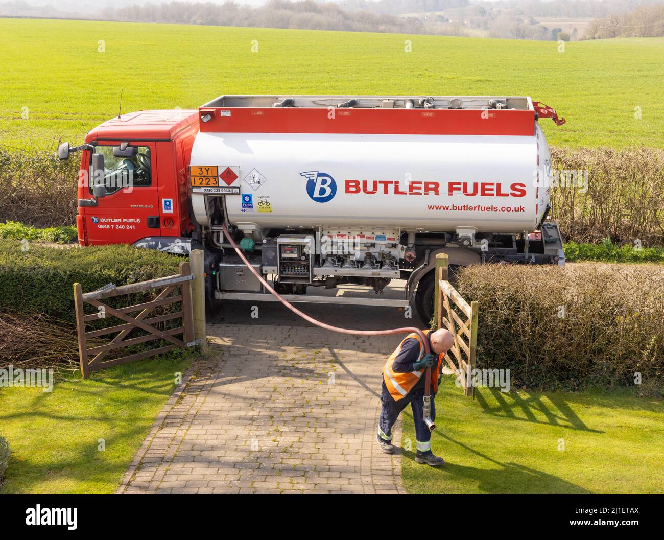 Man preparing to deliver heating oil to a rural household. Hertfordshire. UK Stock Photo
