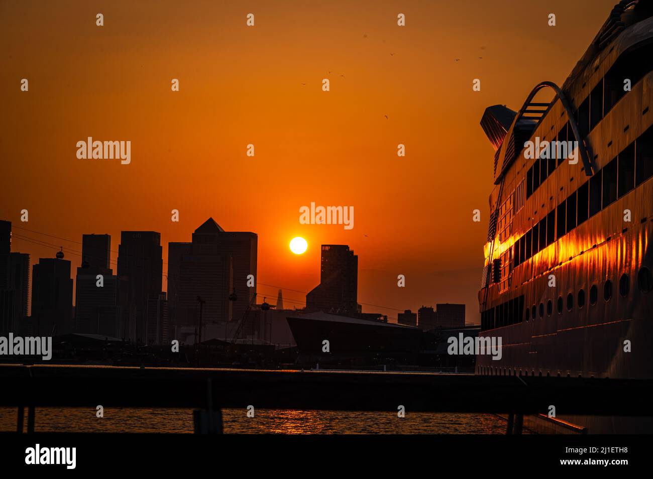 View towards Canary Wharf at sunset, London, UK Stock Photo