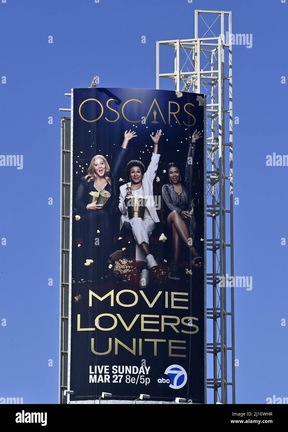 Los Angeles, United States. 25th Mar, 2022. An oversized replica of the official 94th annual Academy Awards ceremony of hosts Amy Schumer, Wanda Sykes and Regina Hall (L-R) hovers over Hollywood Blvd. as the Oscar ceremony is hours away at the Dolby Theatre in the Hollywood section of Los Angeles on Thursday, March 24, 2022. Oscar winners will be announced during an ABC telecast on Sunday, March 27th. Photo by Jim Ruymen/UPI Credit: UPI/Alamy Live News Stock Photo
