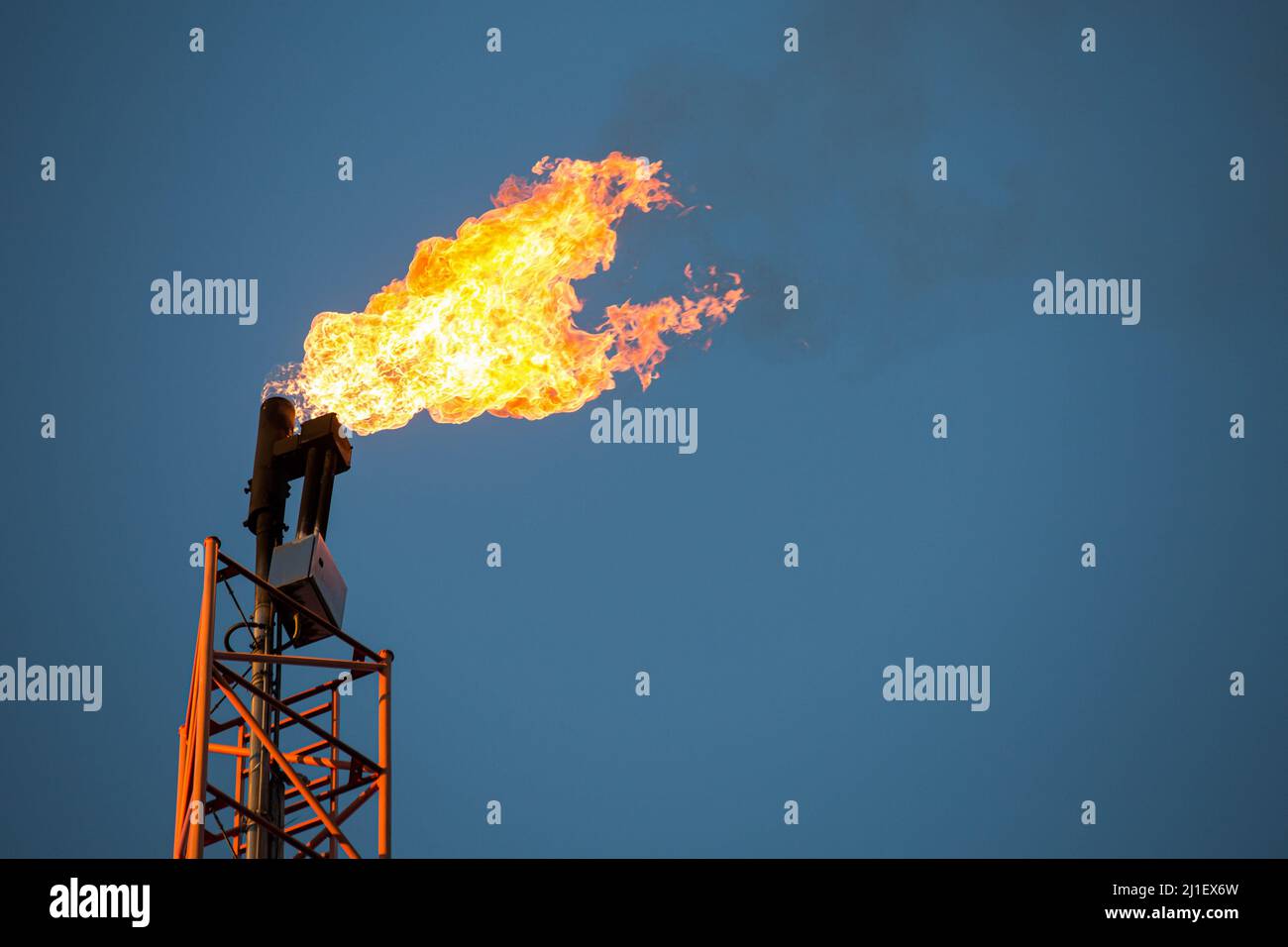 A burning flare seen at an oil extraction area located in Lakie, Lubusz Voivodeship. The characteristic flaming flare is formed by the combustion of natural gas, which is extracted along with crude oil. It is used when the operator does not have a gas transmission installation or the further management of the extracted raw material is economically unprofitable. PGNiG (Polish Oil Mining and Gas Extraction S.A.) plans to spend PLN 10.8 billion on investments in 2022, the company announced in its annual report. The estimated oil production in Poland in 2022 is 0.677 million tones. Stock Photo