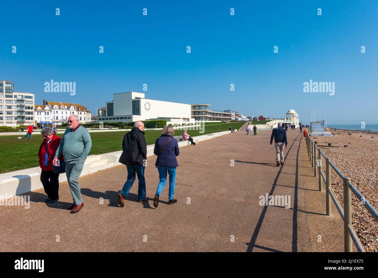 Visitors, cyclists,walkers and dog walkers make the most of the warm early spring weather, Bexhill on Sea, East Sussex, UK Stock Photo