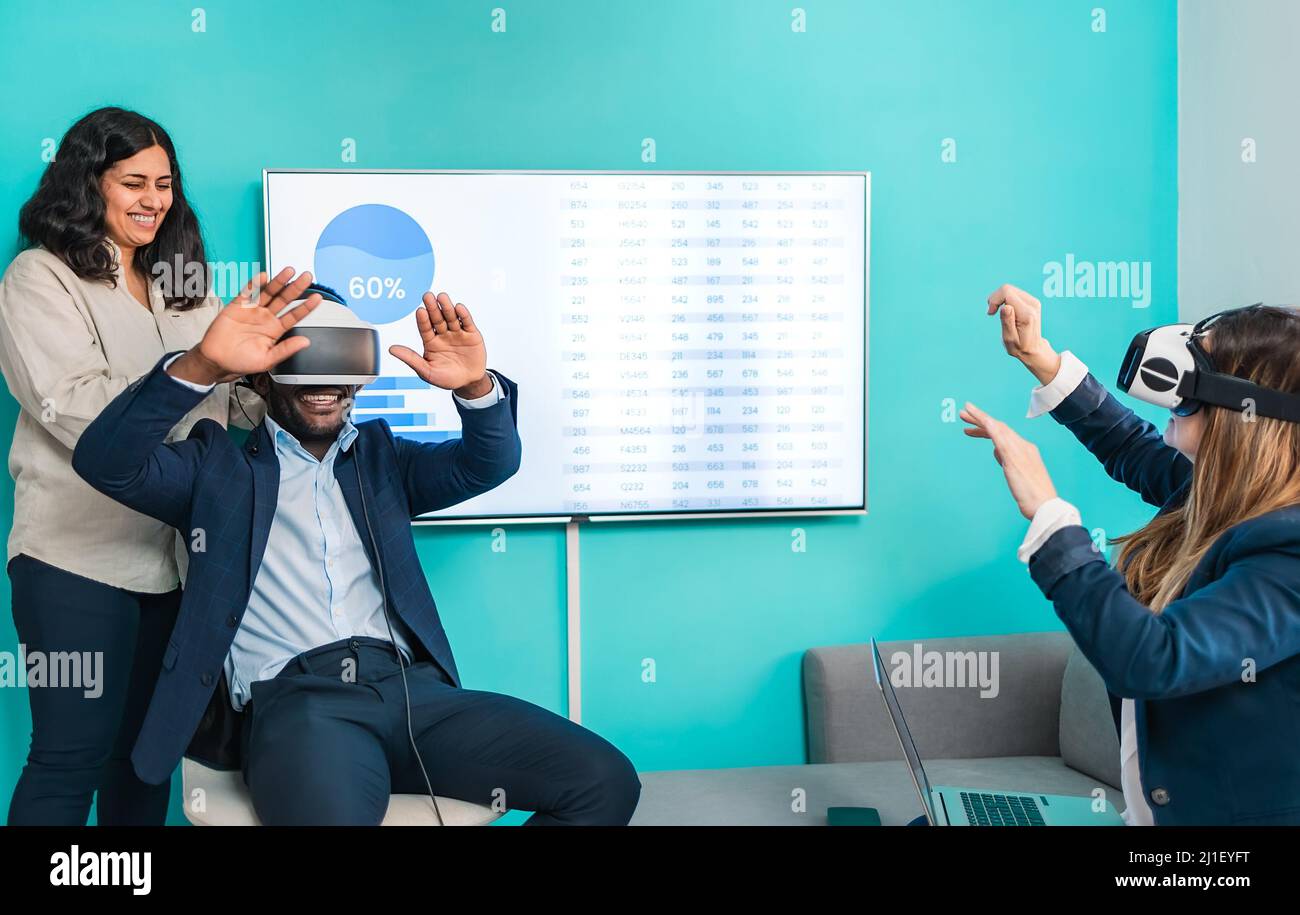 Multiracial business people using virtual reality glasses technology - Metaverse concept Stock Photo