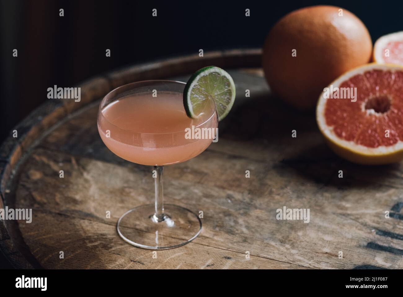 Hemingway daiquiri grapefruit gin cocktail with lime wheel sitting on