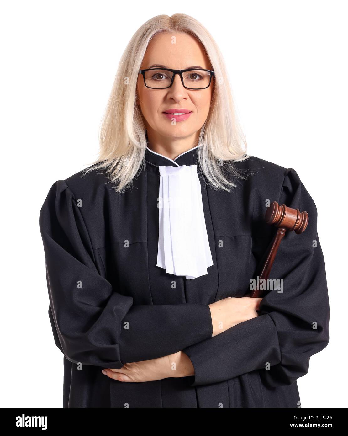 Mature female judge in robe with gavel on white background Stock Photo Alamy