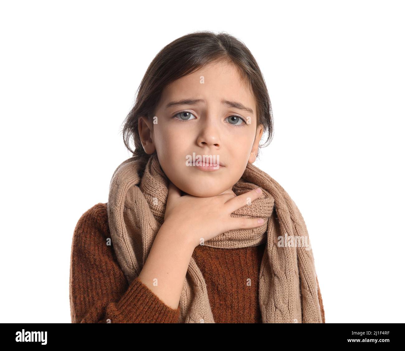 Little girl with scarf suffering from sore throat on white background Stock Photo Alamy