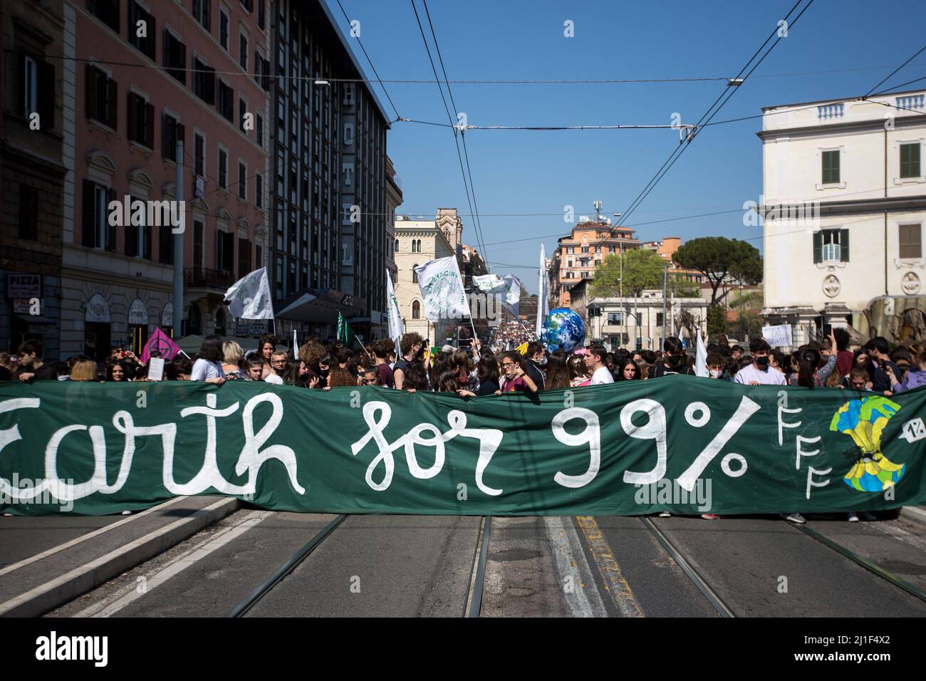 Rome, Italy. 25th Mar, 2022. Today, Fridays for Future Rome - supported by various other environmentalist organizations and movements - held a demonstration in central Rome called Global Strike For Climate. The aim of the rally was to call the Italian Government and all the world Governments, to act for an immediate plan, investments and policies against the so called climate changes and the consequent climate crisis. Stock Photo