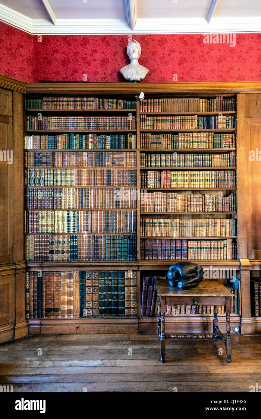 Door hidden in a bookshelf at the library in Knebworth House, Hertfordshire, UK Stock Photo