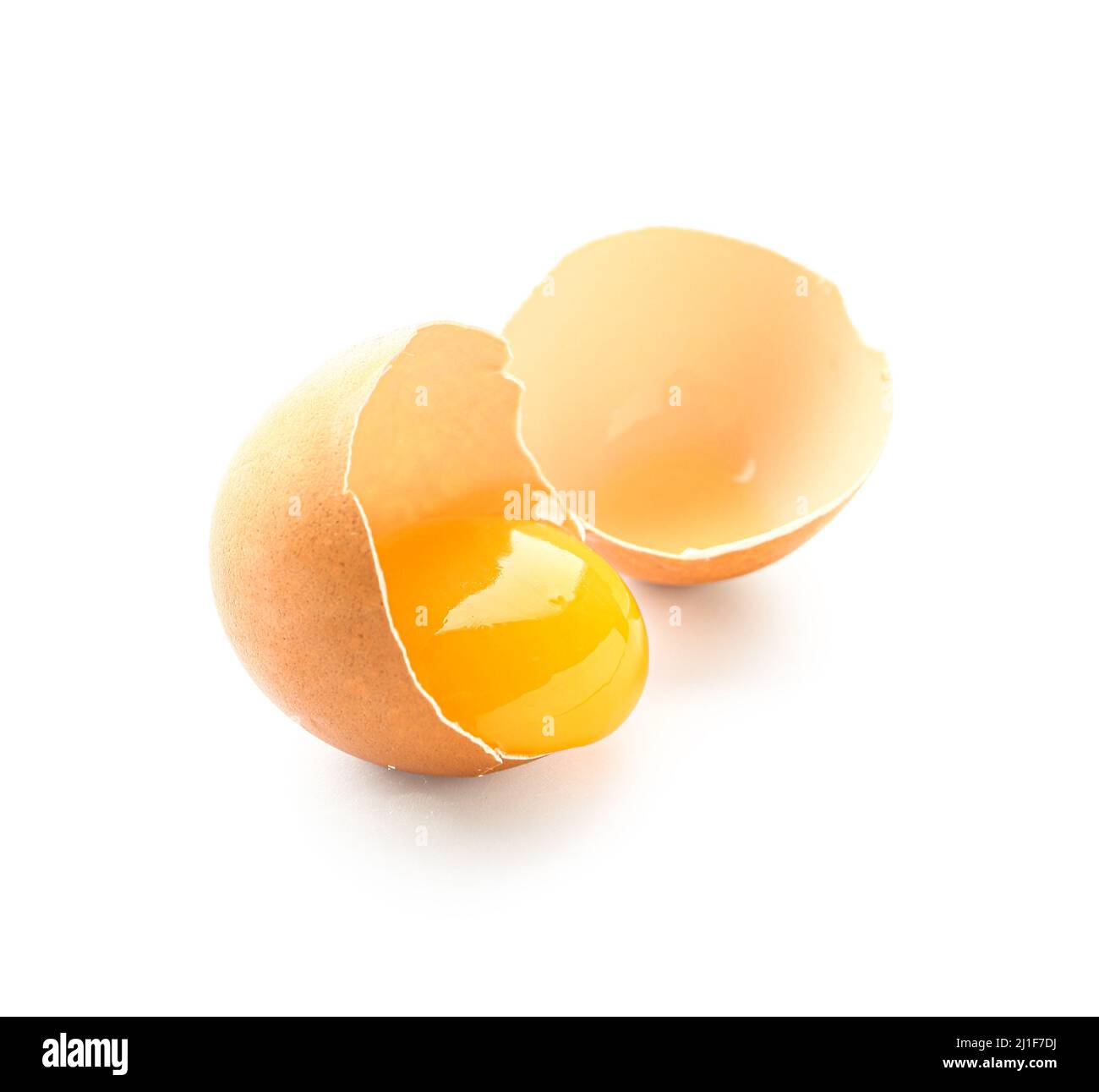 Cracked chicken egg isolated on white background Stock Photo - Alamy