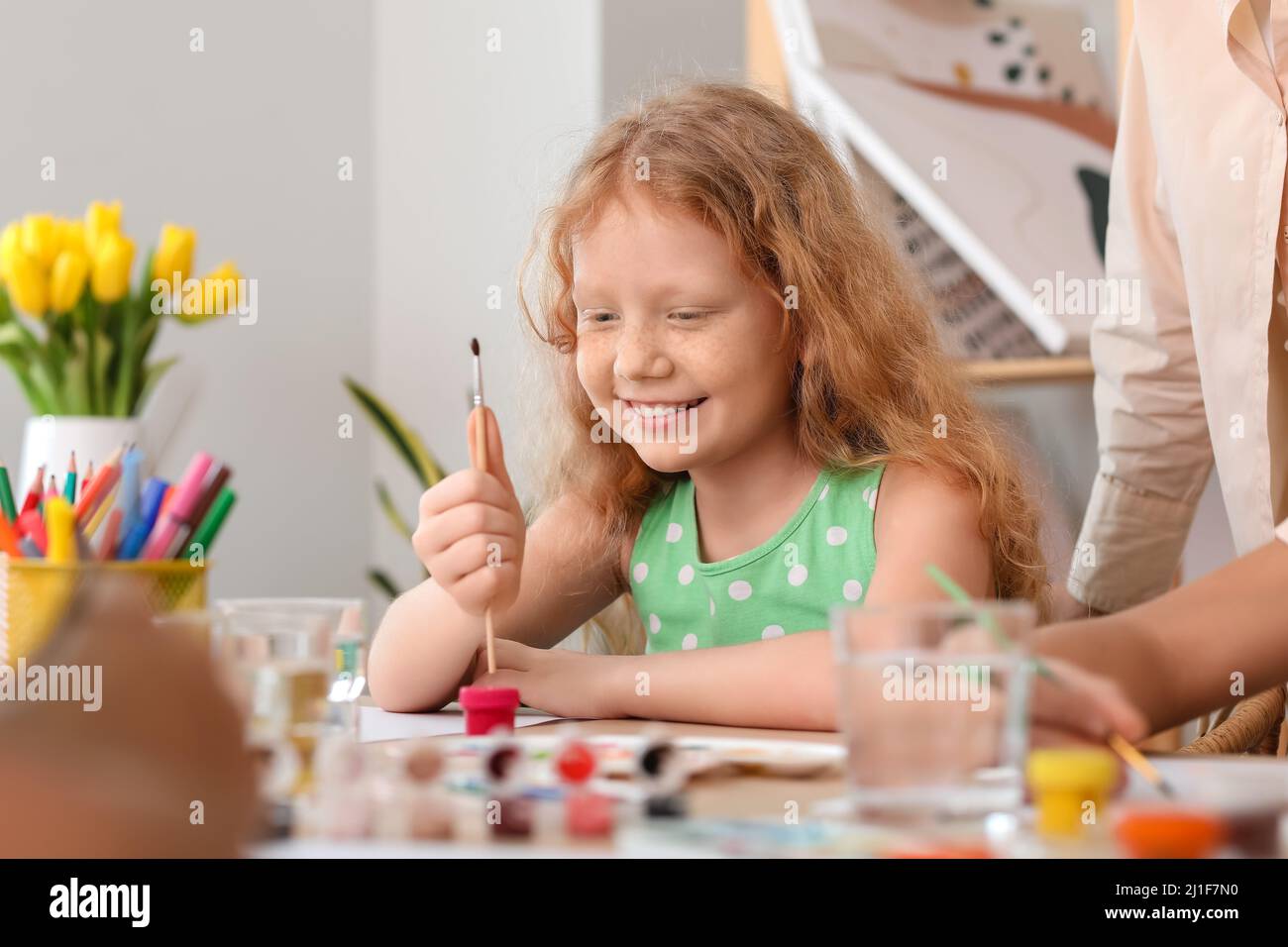 Cute girl painting during master-class in art Stock Photo