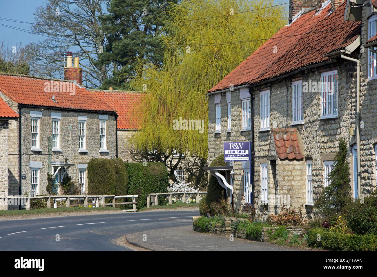 House for sale sign in the village of Hovingham in Ryedale district