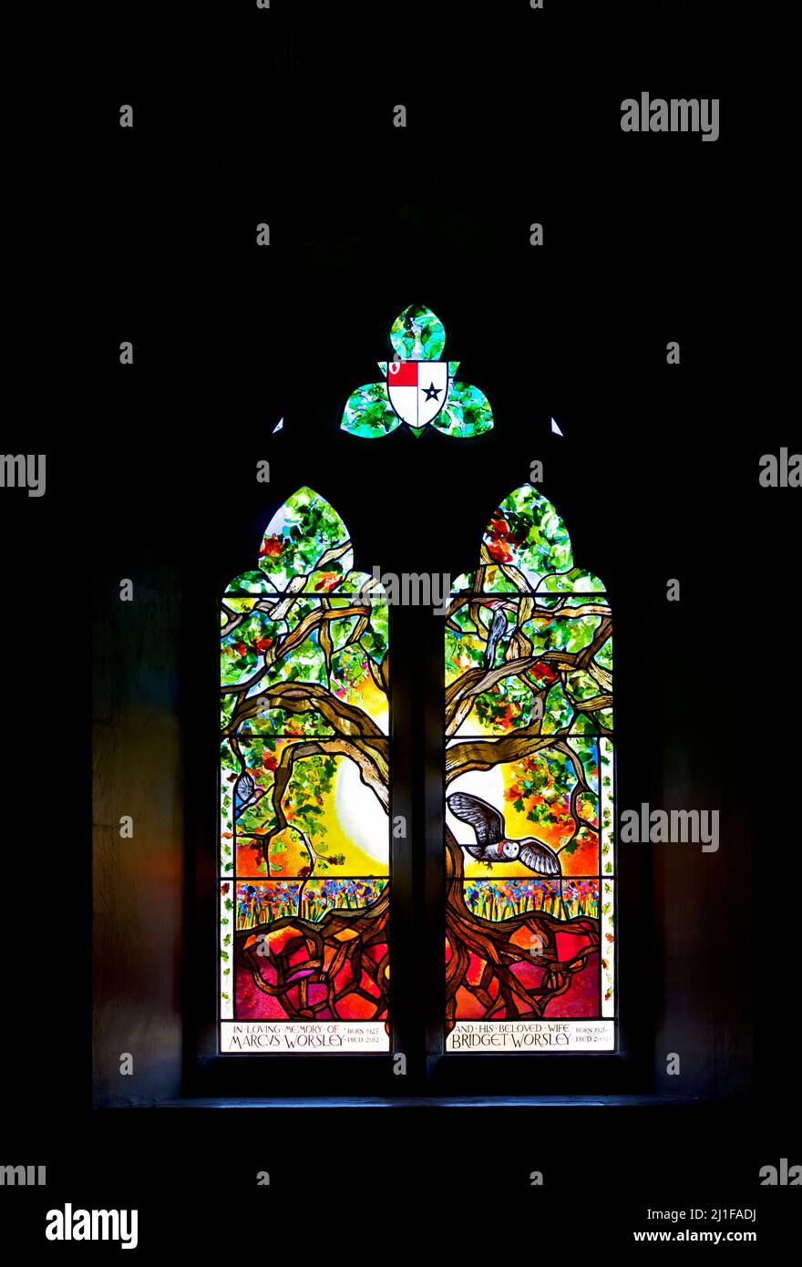 Stained glass window in All Saints church, in the village of Hovingham in Ryedale district, North Yorkshire, England UK Stock Photo